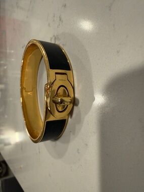 COACH Gold Tone Black Enamel Turn-Lock Bangle Bracelet